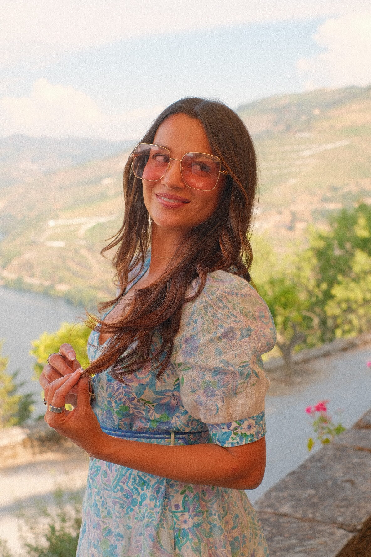 Parina and Sid embracing among the terraced vineyards of the Douro Valley, Portugal